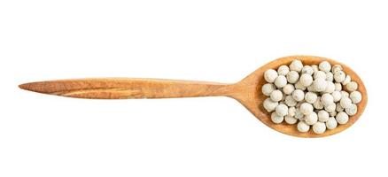 top view of wood spoon with white pepper isolated photo