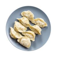 top view of several boiled dumplings on gray plate photo