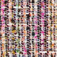 coloridos hilos tejidos de tela boucle de cerca foto