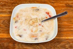 soup with sour cabbage and cream in ceramic plate photo