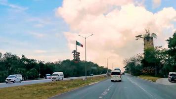 Playa del Carmen Quintana Roo Mexico 2022 Mexican flag on highway freeway in Playa del Carmen Mexico. video