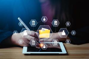 Document management system concept Businessman working on digital tablet document management system DMS, virtual online document database. and process automation to manage files efficiently photo