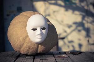 Mask and a pumpkin. photo