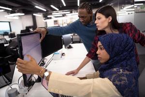 multiethnics team of software developers working together photo