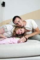 indoor portrait with happy young famil and  cute little babby photo