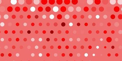 Light red vector pattern with spheres.