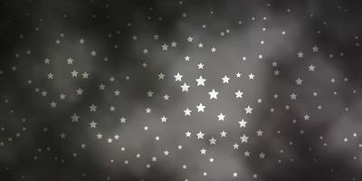 diseño vectorial gris oscuro con estrellas brillantes. vector