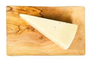 view of Pecorino Romano cheese on board isolated photo