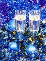 two champagne glasses in blue Xmas decorations photo