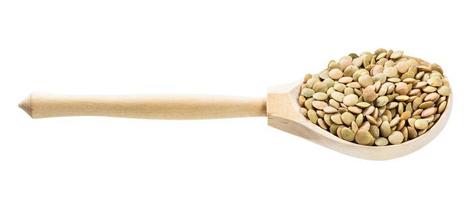 wood spoon with whole large green lentils isolated photo