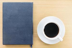 Notebook and Coffee cup photo