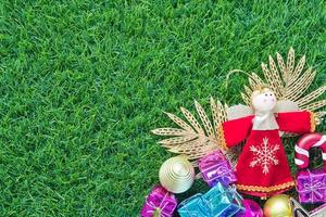 Christmas decoration on green grass background photo