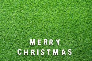 Christmas alphabet on green grass photo