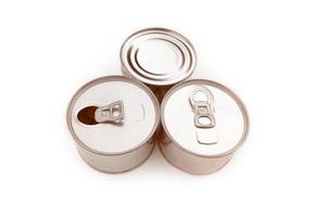 Steel and tin cans on white background, soft and selective focus. photo