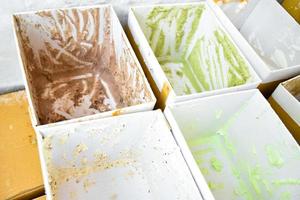 Boxes of various flavor ice cream in the freezer which had sold out and empty, soft and selective focus. photo