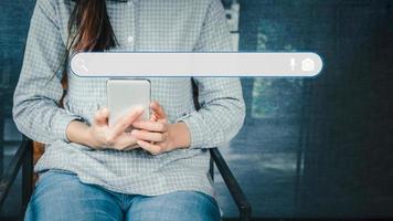 Adult woman using smartphone in the cafe for searching browsing internet data information. Business concept for Using search with your website. photo