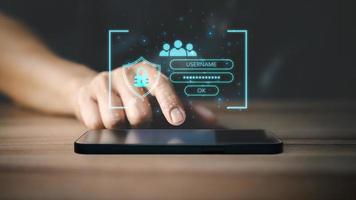 Man typing login and password on smartphone, cyber security concept, Secure encryption and access to the user's private information to access the Internet. photo