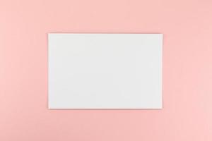 Blank A4 paper sheet mockup on pink background photo