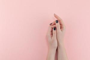 Woman's hands with black manicure photo