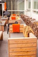 Outdoor restaurant terrace with wooden furniture photo