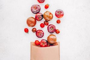 Tomatoes Mar Azul on white wooden table background photo