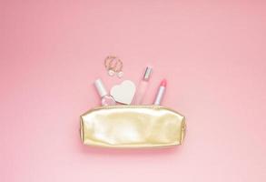 Golden female purse with cosmetics photo