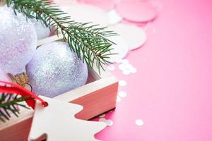 Christmas pearl decoration balls pink background photo