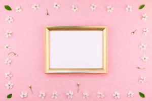 Blank frame mockup with white flowers photo