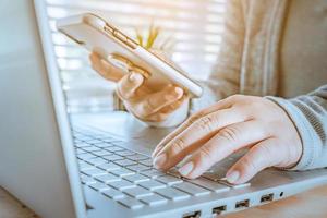 woman using laptop, searching web, browsing information, Close up of business women working with typing on laptop empty at workplace.Selective focus photo