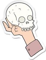 sticker of a cartoon hand holding skull vector