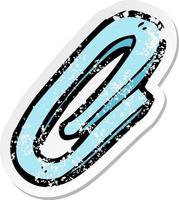 retro distressed sticker of a cartoon paperclip vector
