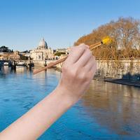 paintbrush paints trees in yellow colour in Rome photo