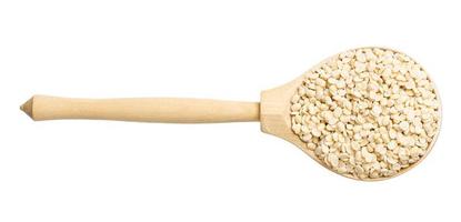 top view of raw urad dal beans in wood spoon photo