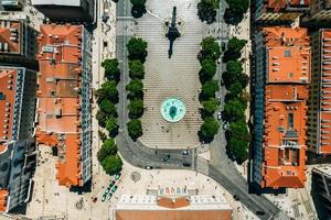 Top down aerial view of Dom Pedro IV square in Baixa District of Lisbon, Portugal photo