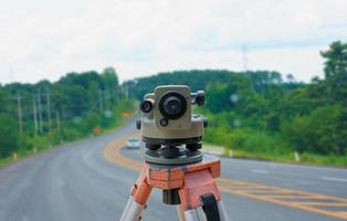 road construction site, theodolite instrument for road construction photo