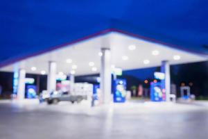 Blur Gas station at night time for background photo