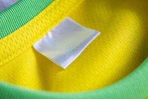 clothes label on sport textile football shirt background photo