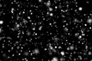 Abstract snowfall on black background photo