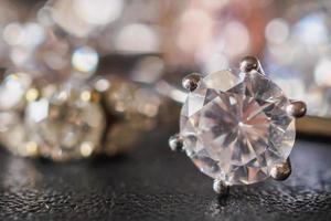 Jewelry diamond rings set on black background close up photo