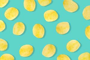 Potato chips pattern on pastel blue background top view flat lay photo