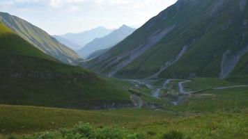 Mountains panorama with two cups cling salute in morning video