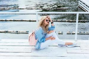 Blonde woman with a bag photo