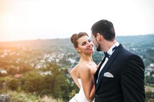 Wedding couple posing for the camera photo