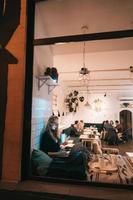 Woman works at a cafe in the evening photo