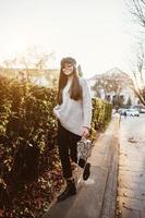 Street portrait of young beautiful fashionable woman photo