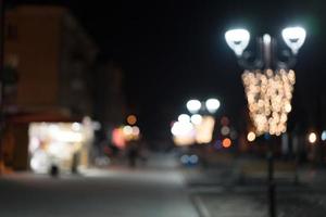 Night city street lights bokeh background photo