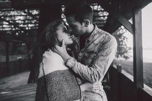 Young couple wrapped in plaid photo