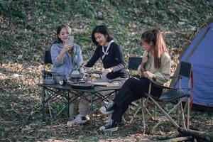 three bestie go camping in the forest photo