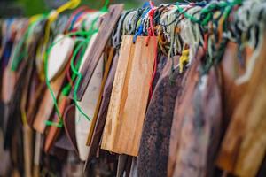 Prayer tags tied to a  on the bridge in the etong village in kanchanaburi City Thailand.Pilok mine The Old mine near the Thai-Myanmar border photo