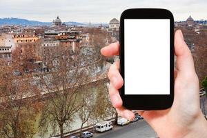 smartphone and autumn Rome skyline photo